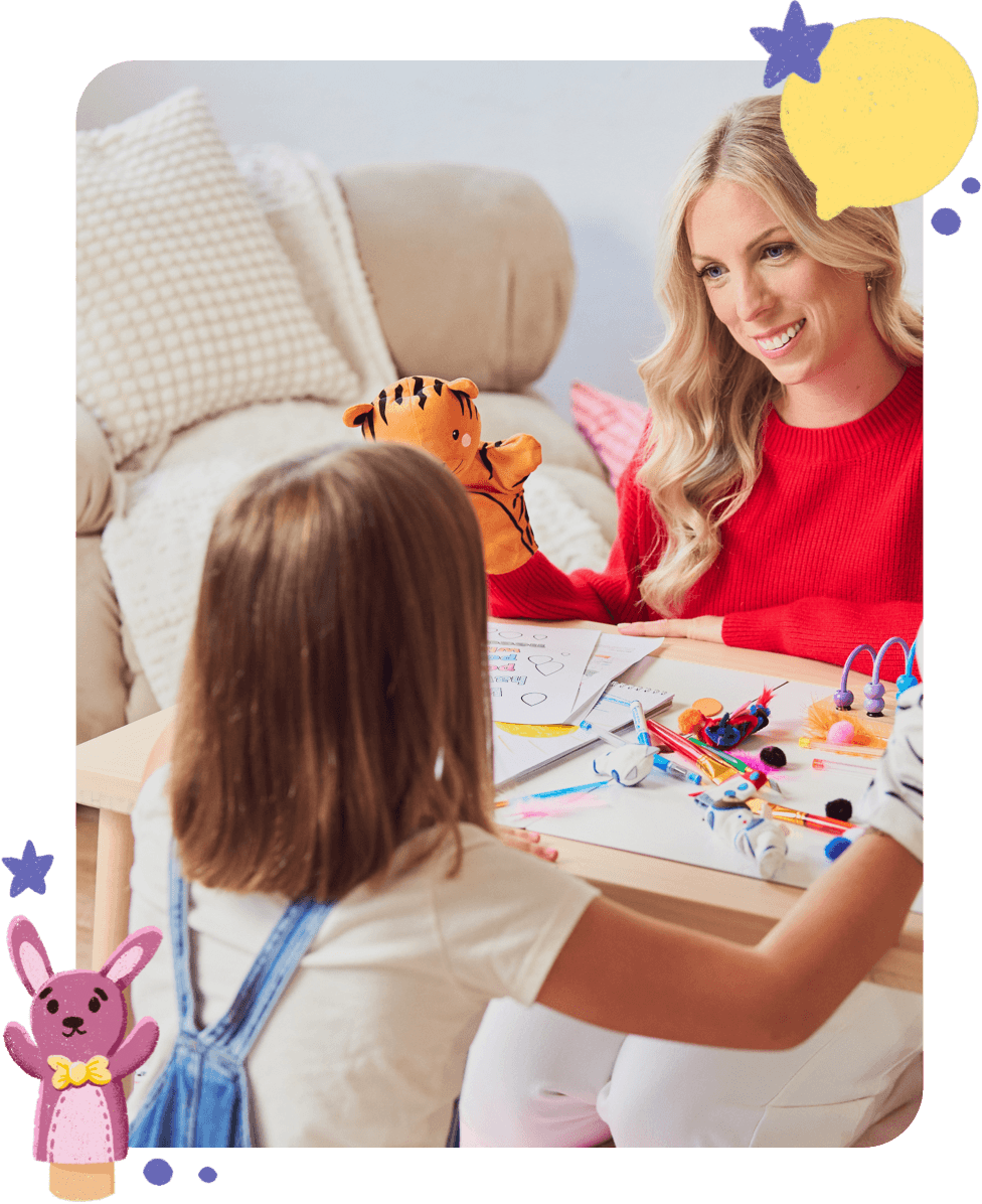 Jess VanderWier doing a creative activity with children at a table.